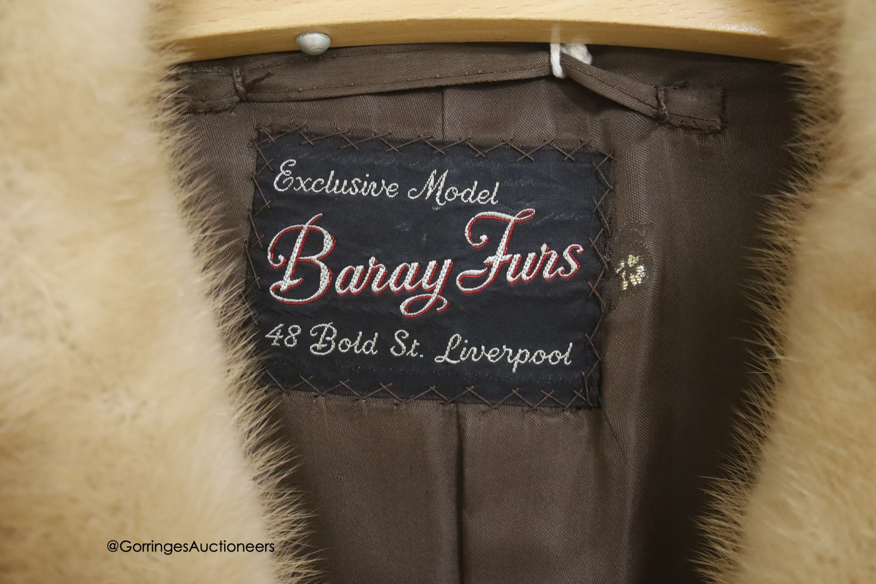 A ladies dark brown squirrel coat with blond mink collar by Baray Furs.